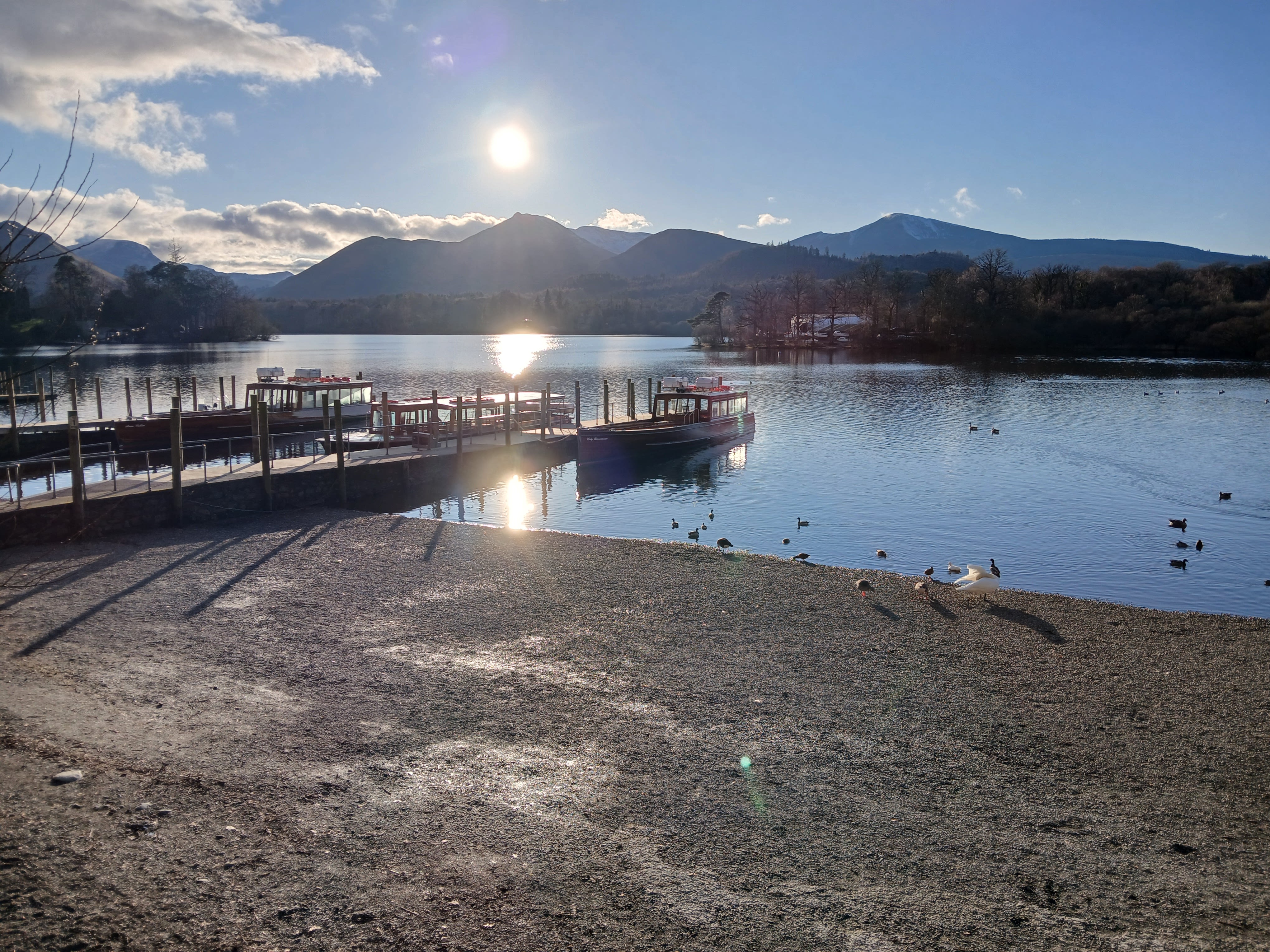Lake surrounded by mountains showing a different swimming environment